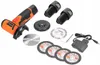 A set of tools including a cordless angle grinder, batteries, charger, and various cutting discs, laid out on a white background. Podgląd zdjęcia produktu