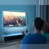 A couple is watching TV in a dimly lit room, with LED lights illuminating the TV. Anteprima dell’immagine prodotto