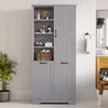 A gray bathroom cabinet with open shelves and two doors, containing various items like bottles, towels, and a basket. Náhľad obrázku produktu