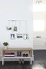 A hallway or entryway with a shoe bench and a photo collage on the wall. Podgląd zdjęcia produktu