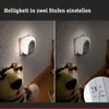Two images of a plug-in night light with a stuffed animal in front of it, showing different brightness settings. A close-up of the switch is also shown. Produktbild-Vorschau