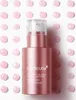 A pink serum bottle with a pump dispenser, surrounded by pink droplets on a white background. Produktbild-Vorschau