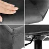 A collage of four close-up images showing the details of a black bar stool, including its fabric texture, stitching, and base. Voir les images du produit