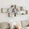 A wooden wall shelf unit mounted on a white wall, decorated with various items. Náhľad obrázku produktu