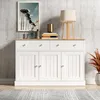 A white sideboard with wooden top, decorated with a framed picture, books, and a lamp. Voir les images du produit