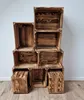 A stack of wooden crates against a white wall. Náhled obrázku produktu