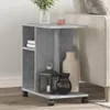 A side table with decorative items next to a sofa. Produktbild-Vorschau