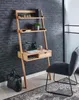 A wooden ladder desk with a laptop, plant, and books is set up in a room with a brick wall and a chair nearby. Voir les images du produit