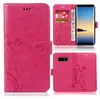 A collage of images showing a pink phone case with a floral and butterfly design, including a view of the case open with cards and money inserted, and a view of the back of the case with a phone inserted. Produktbild-Vorschau