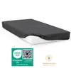 A dark gray fitted sheet is shown on a white mattress against a white background. Below the sheet are two certification logos and a washing instruction icon. Produktbild-Vorschau