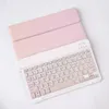 A pink tablet case with an attached keyboard is shown on a white background. Náhľad obrázku produktu