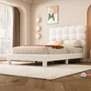 A bedroom scene with a bed, rug, and wall decor. Produktbild-Vorschau