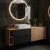 A modern bathroom vanity with a sink and mirror. Voir les images du produit