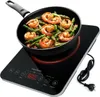 A frying pan with shrimp and asparagus on an induction cooktop. Podgląd zdjęcia produktu