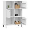 A white bookshelf with several compartments, some open and some with doors. Decorative items like a plant, a basket with books, a calendar, and another basket with rolled items are placed inside. Produktbild-Vorschau