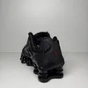 A black Nike Shox TL sneaker is shown from a rear-side angle against a plain background. Produktbild-Vorschau