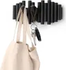 A black wall-mounted coat rack with a beige tote bag and keys hanging from it. Anteprima dell’immagine prodotto
