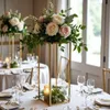 A table setting with floral arrangements and candles. Produktbild-Vorschau