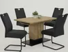 A dining table with four chairs set against a white background. Produktbild-Vorschau
