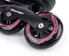A close-up view of the wheels and frame of black inline skates with pink accents. Voir les images du produit