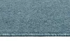 A close-up view of a blue carpet with a textured surface and a finished edge. Produktbild-Vorschau