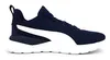 A side view of a navy blue Puma training shoe with a white stripe on a white background. Produktbild-Vorschau
