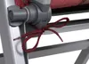 A close-up shot of a red tie-down strap on a gray chair frame. Produktbild-Vorschau