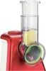 Close-up of a red and white electric grater with a slice of potato inside the transparent chute. Produktbild-Vorschau