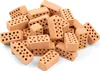 A pile of small, red bricks with holes. Náhľad obrázku produktu