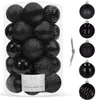 A clear product shot of black Christmas ornaments in a clear container, with individual ornaments displayed to the right. Náhľad obrázku produktu