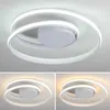 A modern LED ceiling light with a spiral design is shown in three different lighting conditions. Produktbild-Vorschau