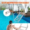 A person is using a dock stair ladder in a swimming pool next to a wooden dock with white curtains. Náhľad obrázku produktu