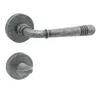 A door handle set with a round rosette and a lever handle, presented against a white background. Produktbild-Vorschau