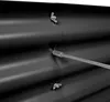 Close-up of a black corrugated metal raised garden bed with a metal rod inserted through it, showing the fastening mechanism. Produktbild-Vorschau