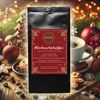 A coffee bag and a cup of coffee are displayed in a festive Christmas setting with decorations. Produktbild-Vorschau