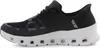 A side view of a black and white sneaker. Voir les images du produit