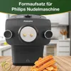A Philips pasta maker attachment with churros in the foreground, set on a wooden table. Produktbild-Vorschau