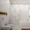 A modern, minimalist bathroom with white fixtures and a glass shower enclosure. Produktbild-Vorschau