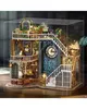 A detailed 3D model of a miniature magical house with a clock tower, stairs, and plants, enclosed in a clear display case. Náhled obrázku produktu