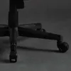 A close-up view of the base and wheels of a black office or gaming chair. Anteprima dell’immagine prodotto