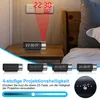 A digital projection alarm clock is shown on a nightstand, projecting the time onto a wall. The image also displays different brightness settings and close-ups of the clock. Produktbild-Vorschau
