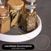 A rotating organizer tray with spice jars on a dark surface. Produktbild-Vorschau
