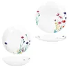 A collage of white plates and bowls decorated with floral patterns. Produktbild-Vorschau