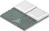 A close-up, isometric view of a tile sample, showing the top surface and the layered structure underneath. Voir les images du produit