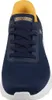 A close-up, front-facing view of a navy blue Skechers sneaker with yellow accents. Voir les images du produit