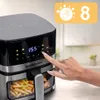 A hand is shown pressing a button on a digital air fryer display. French fries are visible in the transparent drawer. Anteprima dell’immagine prodotto