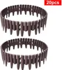 Two brown plastic garden borders arranged in circles on a white background. Produktbild-Vorschau