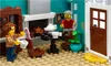 A LEGO scene depicting an interior of a building with two minifigures, furniture, and accessories. Produktbild-Vorschau
