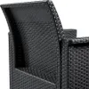 Close-up view of the textured back and armrest of a black rattan-style garden chair. Produktbild-Vorschau