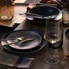 A beautifully set dining table with plates, cutlery, and a wine glass, suggesting a meal or gathering. Náhľad obrázku produktu